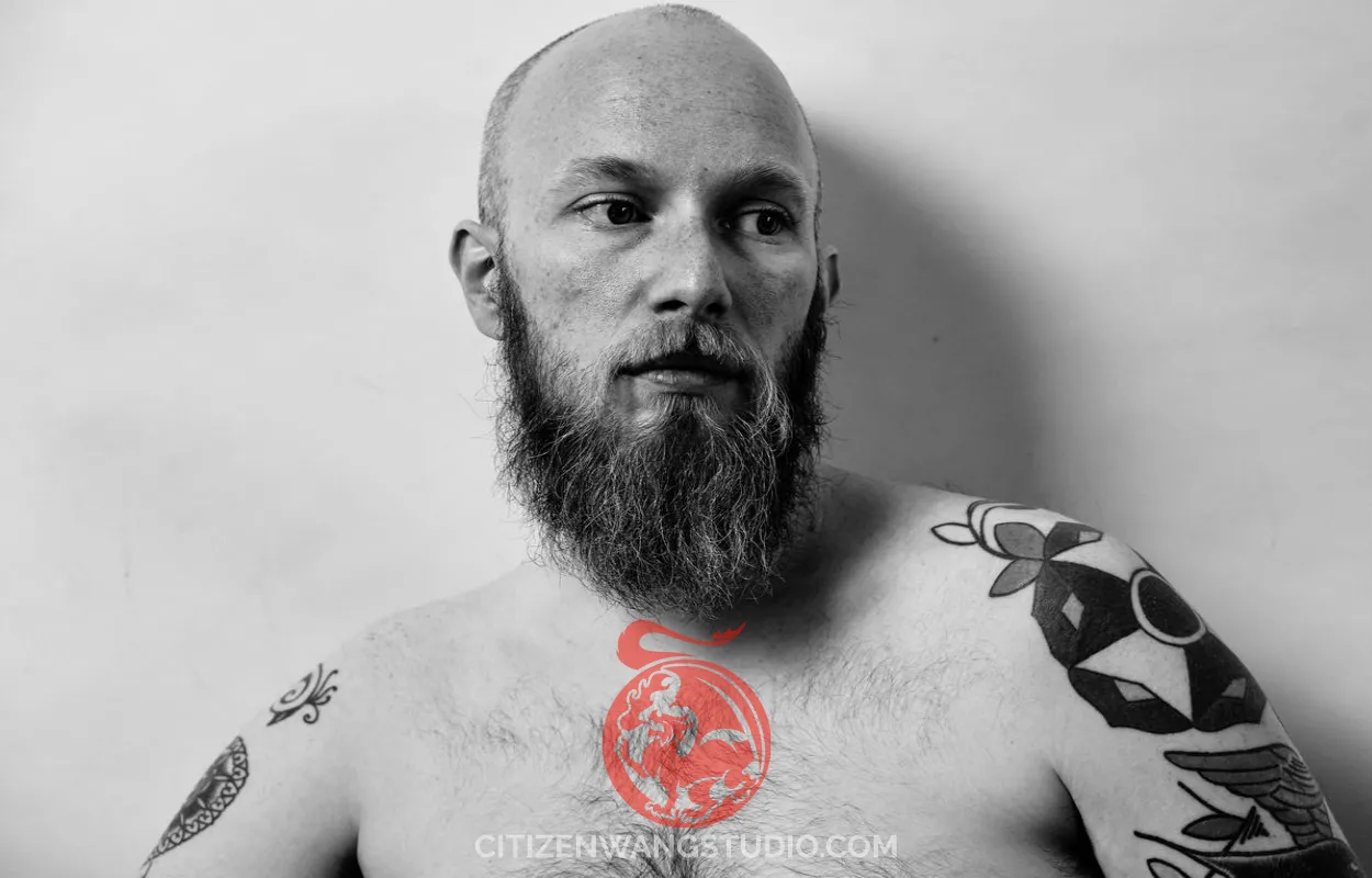 man-with-tattoo-black-and-white.jpg